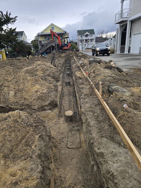 Footer trench with forms and rebar at a residential lot