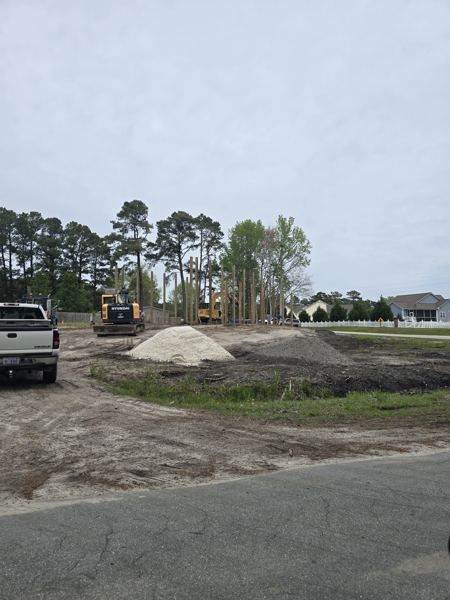 Cleared and graded lot with stone delivered for a slab
