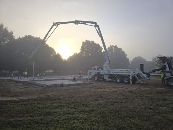 Pump boom over a slab at sunrise